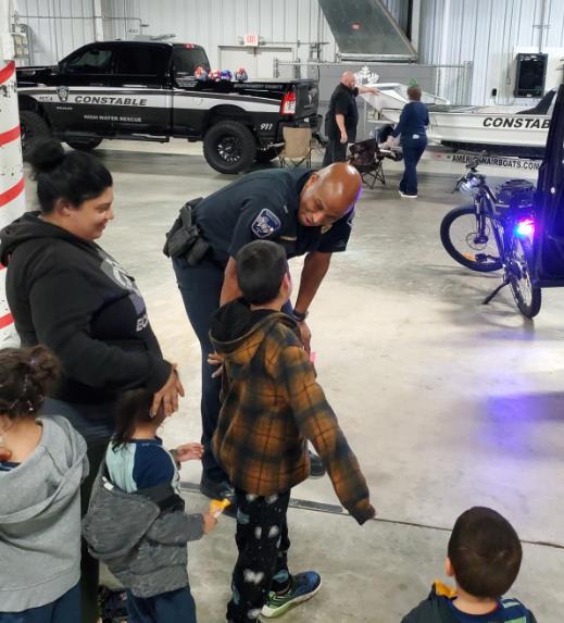Photo of a Montgomery County Constable Deputy interacting with Blue Elf guests.